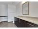 A bathroom with a vanity featuring granite countertops, stainless steel fixtures, and tiled floors at 1080 Peachtree Ne St # 2003, Atlanta, GA 30309