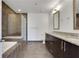 Modern bathroom with walk-in shower, soaking tub, and double vanity at 1080 Peachtree Ne St # 2003, Atlanta, GA 30309