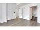 A spacious bedroom with hardwood floors and white doors providing access to various areas of the home at 1080 Peachtree Ne St # 2003, Atlanta, GA 30309