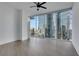 Bright bedroom with ceiling fan and floor-to-ceiling windows boasting city views at 1080 Peachtree Ne St # 2003, Atlanta, GA 30309