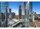 View of the modern cityscape and surrounding green spaces from the building at 1080 Peachtree Ne St # 2003, Atlanta, GA 30309