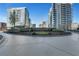 Beautifully landscaped circular entrance to luxury high-rise buildings with modern architecture at 1080 Peachtree Ne St # 2003, Atlanta, GA 30309