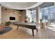 Bright game room featuring a billiards table, lounge seating, and floor-to-ceiling windows at 1080 Peachtree Ne St # 2003, Atlanta, GA 30309