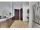 Practical kitchenette with stainless steel appliances, granite countertops, and wood flooring at 1080 Peachtree Ne St # 2003, Atlanta, GA 30309