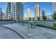 Outdoor dining area with tables and chairs overlooking the city skyline, perfect for entertaining at 1080 Peachtree Ne St # 2003, Atlanta, GA 30309