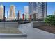 Relaxing rooftop lounge features seating areas, decorative umbrellas and a garden, perfect for outdoor enjoyment at 1080 Peachtree Ne St # 2003, Atlanta, GA 30309
