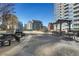 An outdoor patio area with lounge seating, dining tables, and a shared pool at 1080 Peachtree Ne St # 2003, Atlanta, GA 30309