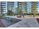 Expansive outdoor patio area with a dining table, lounge seating, and a stunning view of the city at 1080 Peachtree Ne St # 2003, Atlanta, GA 30309