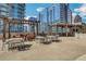 Expansive rooftop deck with outdoor seating, pergolas, and stunning city views at 1080 Peachtree Ne St # 2003, Atlanta, GA 30309