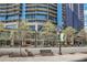 Street view of building with street benches and landscaping at 1080 Peachtree Ne St # 2003, Atlanta, GA 30309