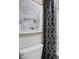 Modern bathroom with stylish patterned curtain and minimalist decor at 1216 Arnhem Dr, Hampton, GA 30228