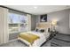 Comfortable bedroom features a large window for natural light and stylish decor at 1216 Arnhem Dr, Hampton, GA 30228