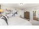 Spacious bedroom with a walk-in closet, neutral decor, and an adjacent bathroom for ultimate comfort at 1216 Arnhem Dr, Hampton, GA 30228