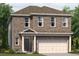 Charming two-story home with brick facade, well-manicured lawn, and attached two-car garage at 1216 Arnhem Dr, Hampton, GA 30228
