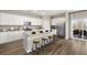 Beautiful kitchen featuring an island, modern stools, stainless appliances, and ample cabinet space at 1216 Arnhem Dr, Hampton, GA 30228