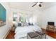 This comfortable main bedroom features a ceiling fan, wood floors and lots of natural light at 1252 Mclendon Ne Ave, Atlanta, GA 30307