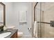Tiled bathroom with a framed mirror and a glass door shower enclosure at 3203 Lenox Ne Rd # 1, Atlanta, GA 30324