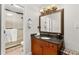 Elegant bathroom with vanity, framed mirror, decorative light fixture, and glass door shower at 3203 Lenox Ne Rd # 1, Atlanta, GA 30324