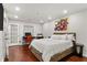 Modern bedroom features hardwood floors, recessed lighting, and stylish decor at 3203 Lenox Ne Rd # 1, Atlanta, GA 30324