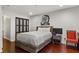 Comfortable bedroom featuring hardwood floors, a bed, and a closet for ample storage at 3203 Lenox Ne Rd # 1, Atlanta, GA 30324
