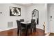 Modern dining room with hardwood floors and a contemporary mirror, adjacent to kitchen at 3203 Lenox Ne Rd # 1, Atlanta, GA 30324