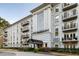 Elegant building featuring a grand entrance, manicured landscaping, and classic architectural details at 3203 Lenox Ne Rd # 1, Atlanta, GA 30324