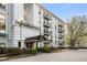 Stately condo building with beautifully maintained landscaping, porte-cochere, and classic design at 3203 Lenox Ne Rd # 1, Atlanta, GA 30324