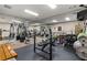 Home gym featuring free weights, weight machines, and mirrors at 3203 Lenox Ne Rd # 1, Atlanta, GA 30324