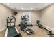 Home gym includes treadmill, elliptical, rowing machine, and wall-mounted tv at 3203 Lenox Ne Rd # 1, Atlanta, GA 30324