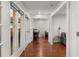 Hallway with hardwood floors leads to a sunroom and office area, enhancing the home's flow at 3203 Lenox Ne Rd # 1, Atlanta, GA 30324