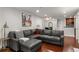Comfortable living room with hardwood floors, gray sofas and modern lighting at 3203 Lenox Ne Rd # 1, Atlanta, GA 30324