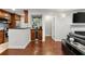 Open-concept space with hardwood floors, built-in bar and fireplace for elegant and comfortable living at 3203 Lenox Ne Rd # 1, Atlanta, GA 30324