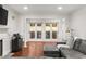 Cozy living room with fireplace and a large comfortable couch with access to a balcony through sliding glass doors at 3203 Lenox Ne Rd # 1, Atlanta, GA 30324