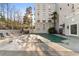 Beautiful building featuring a community pool surrounded by lounge chairs for resident enjoyment at 3203 Lenox Ne Rd # 1, Atlanta, GA 30324