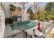 Exterior view of the in-ground pool area with lounge chairs and umbrellas, covered for the season at 3203 Lenox Ne Rd # 1, Atlanta, GA 30324