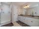 Bathroom featuring a shower and double vanity at 785 Josh Ln, Lawrenceville, GA 30045