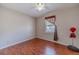 Cozy bedroom with hardwood floors, a ceiling fan, and natural light from the window at 785 Josh Ln, Lawrenceville, GA 30045