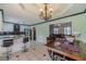 Open dining area with access to an eat-in kitchen and living room at 785 Josh Ln, Lawrenceville, GA 30045