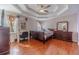 Main bedroom featuring hardwood floors, trey ceiling, a ceiling fan, and lots of natural light at 785 Josh Ln, Lawrenceville, GA 30045