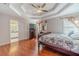 Main bedroom with hardwood floors, trey ceiling, lots of light, and ensuite bathroom at 785 Josh Ln, Lawrenceville, GA 30045
