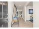 Inviting foyer with wood-look floors, modern decor, and a view into the living spaces at 1220 Arnhem Dr, Hampton, GA 30228
