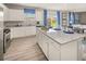Spacious kitchen with white cabinetry, stainless steel appliances, and granite countertops at 1220 Arnhem Dr, Hampton, GA 30228