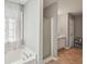 A bathtub and a shower are featured in the Primary bathroom at 1618 Blossom Dr, Atlanta, GA 30349