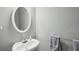 Small half bathroom featuring pedestal sink and towel rack at 1618 Blossom Dr, Atlanta, GA 30349
