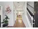 Inviting entryway showcasing hardwood floors, staircase, and views into the dining area at 1618 Blossom Dr, Atlanta, GA 30349