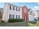 A lovely home with brick and siding, offering a neat front lawn and an attached two-car garage at 1618 Blossom Dr, Atlanta, GA 30349