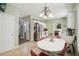 An open kitchen features stainless appliances and flows into dining area with red chairs at 1618 Blossom Dr, Atlanta, GA 30349