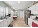 Bright, open kitchen with white cabinetry, stainless steel appliances, and dining area at 1618 Blossom Dr, Atlanta, GA 30349