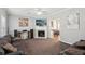 Cozy living room with a fireplace, plush seating, and neutral color palette at 1618 Blossom Dr, Atlanta, GA 30349