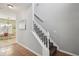 A staircase leads to the upper level, adjacent to an open-concept living and dining space at 1618 Blossom Dr, Atlanta, GA 30349